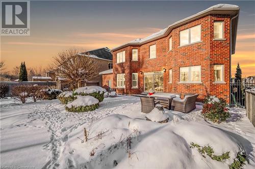 Snow covered house featuring an outdoor hangout area