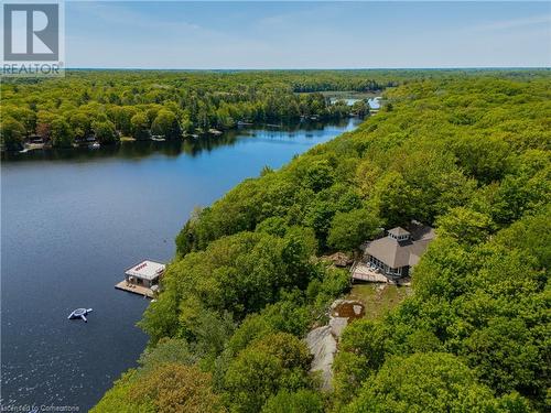 7.1 acres of secluded waterfront property featuring a cottage, boathouse, and direct access to the water via both a boardwalk and an ATV trail.