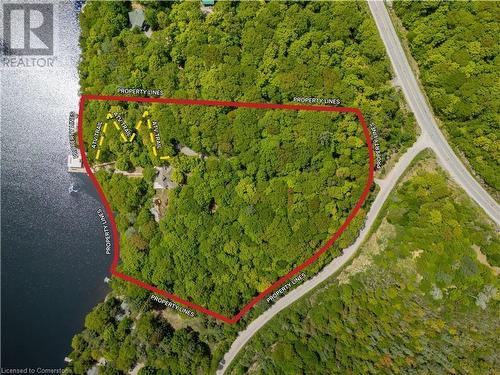 7.1 acres of secluded waterfront property featuring a cottage, boathouse, and direct access to the water via both a boardwalk and an ATV trail.