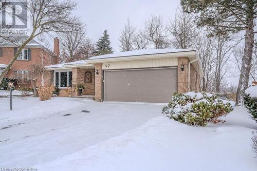 Ranch-style house featuring a garage