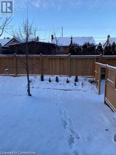 View of yard layered in snow