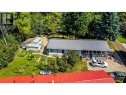 Set on a large lot with mature trees all around
