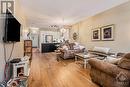 Open concept living/dining with wide plank hardwood floors.