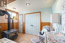 Basement seating area with wood stove