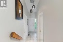 Foyer w access to garage and powder room
