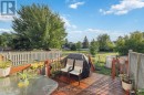 Fenced backyard w view of pathway