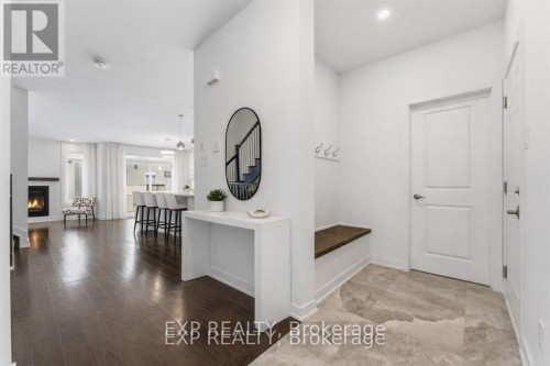Foyer with upgraded floor tile ( virtually staged)