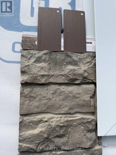 Faux brick & siding to be installed on Pool House