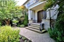 Solid Double Door with Mature Landscaping