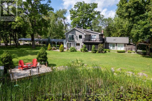East Side of Property with Pond and Deck