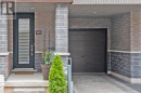 Front Entry, Covered Parking Space and Garage