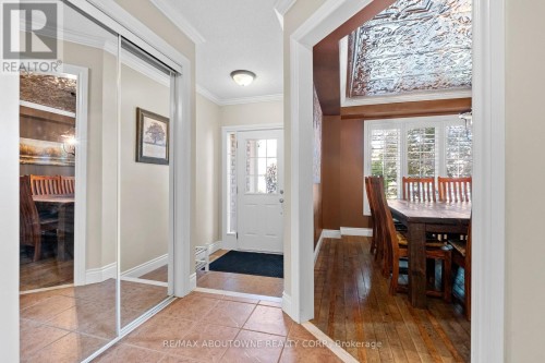 Spacious foyer, mirrored closet & dining room view