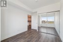 Primary bedroom with mirrored double closet doors