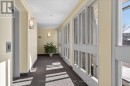 sun-filled living and dining room with walkout